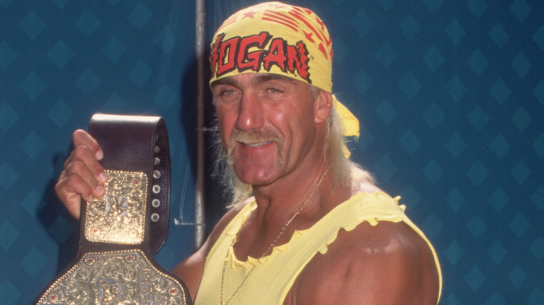 Hulk Hogan holding a wrestling championship