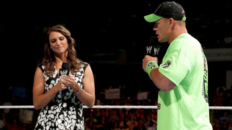 Stephanie McMahon and John Cena in the ring