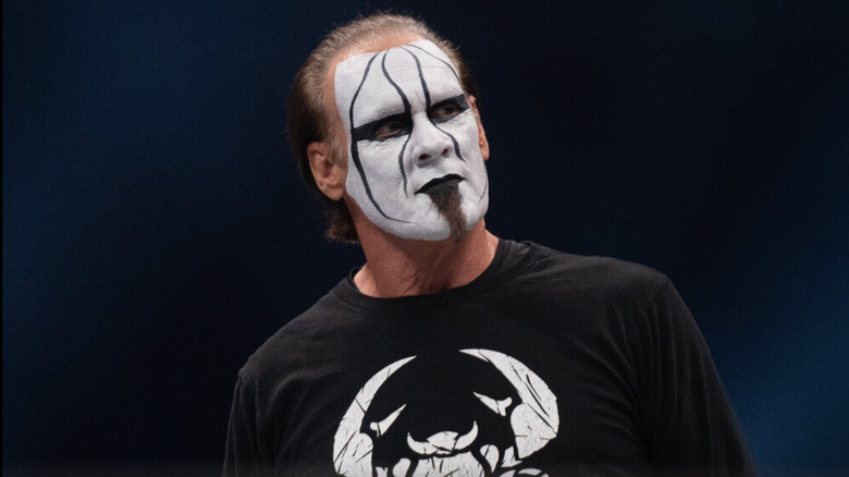 Sting looking to his left