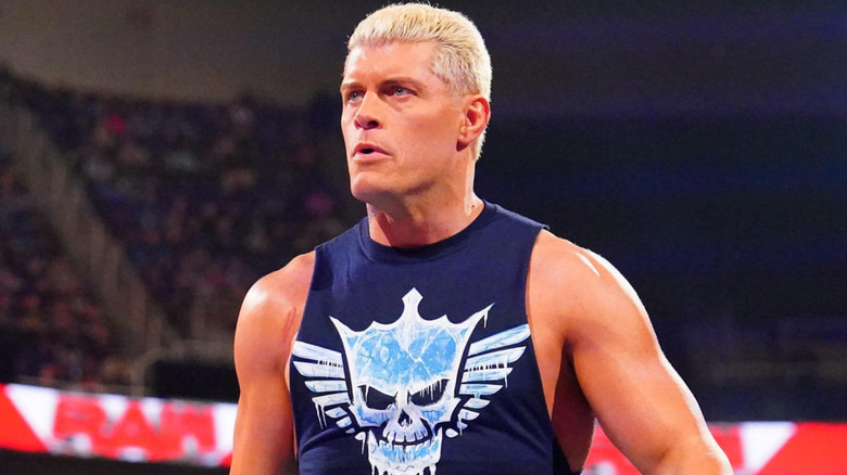 Cody Rhodes wearing a navy blue tank top