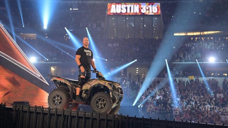 "Stone Cold" Steve Austin looks to the crowd from a four-wheeler on the ramp before making his way down to the ring at WrestleMania 38.
