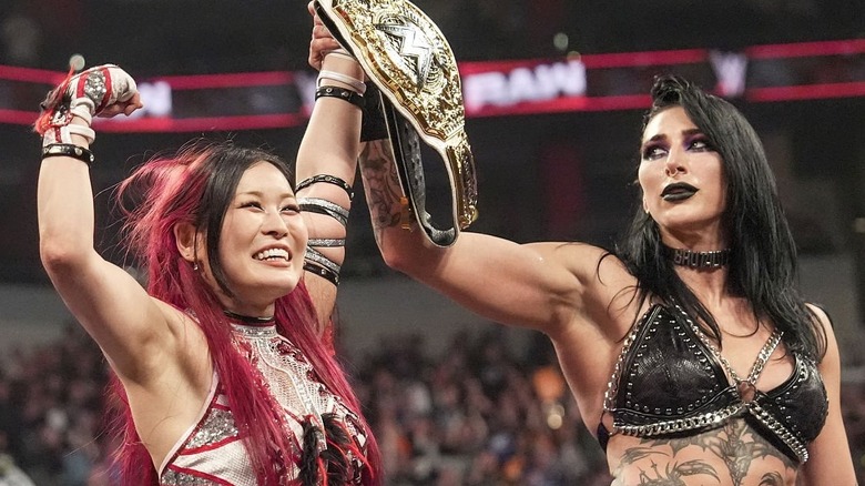 Rhea Ripley eyes IYO SKY's WWE Women's World Championship following a tag match victory.