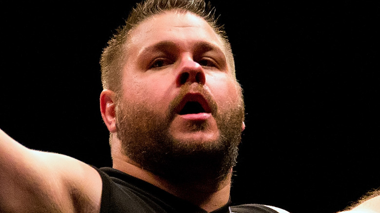 Kevin Owens standing on turnbuckle