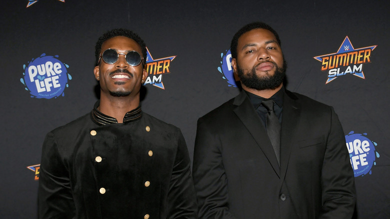 Montez Ford and Angelo Dawkins at a SummerSlam 2021 event