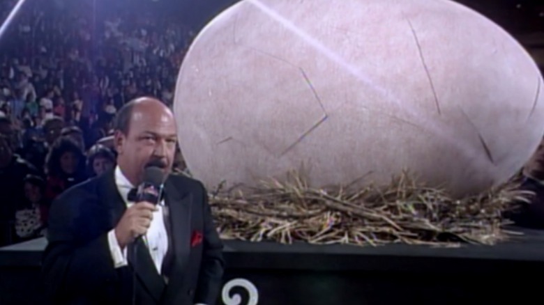 Gene Okerlund next to an egg
