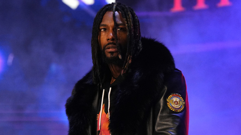 Swerve Strickland in furry black coat