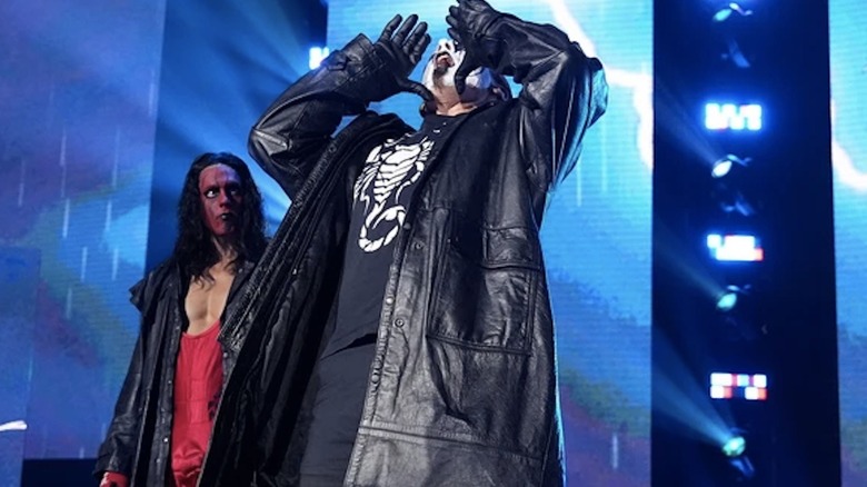 Sting howls on the entrance ramp as his son looks on in full vintage Sting regalia.