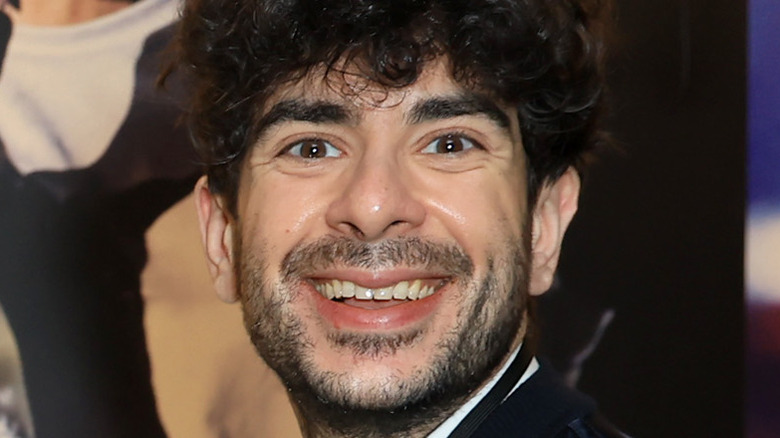 Tony Khan smiles