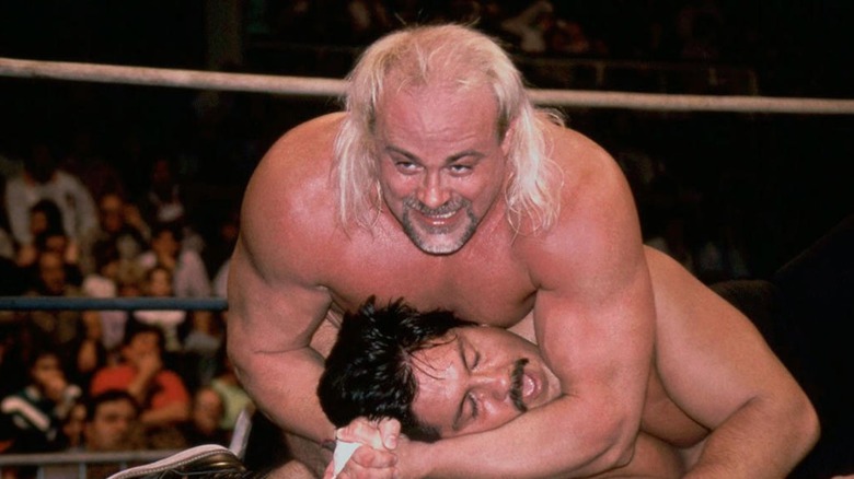 Kevin Sullivan having a man in a chinlock