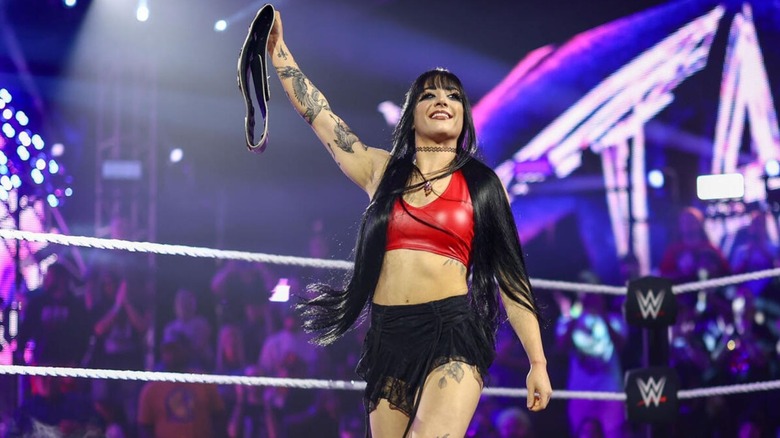 Tatum Paxley holds up the Women's North American Championship as she celebrates with fans during an episode of 