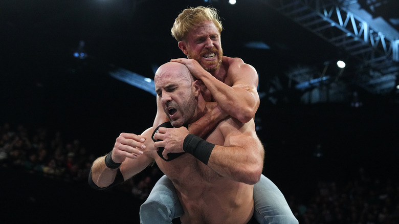 Orange Cassidy clings on to the back of Claudio Castagnoli to put him in a sleeper hold during a match on "AEW Dynamite."