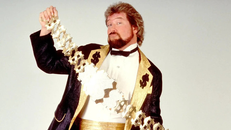 "The Million Dollar Man" Ted DiBiase poses with his Million Dollar Championship