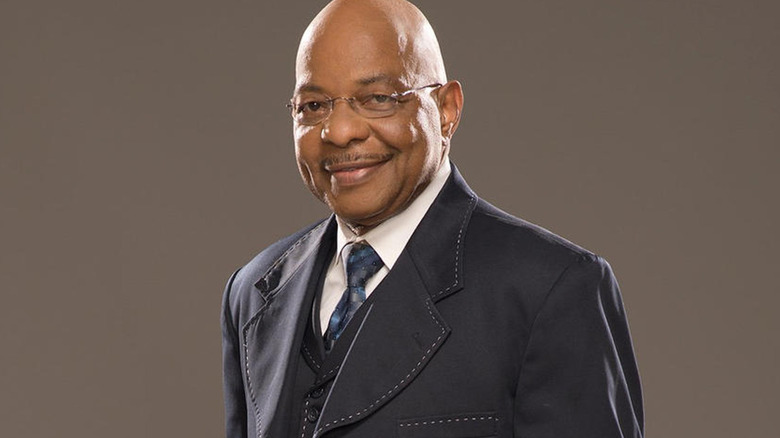 Teddy Long smiles