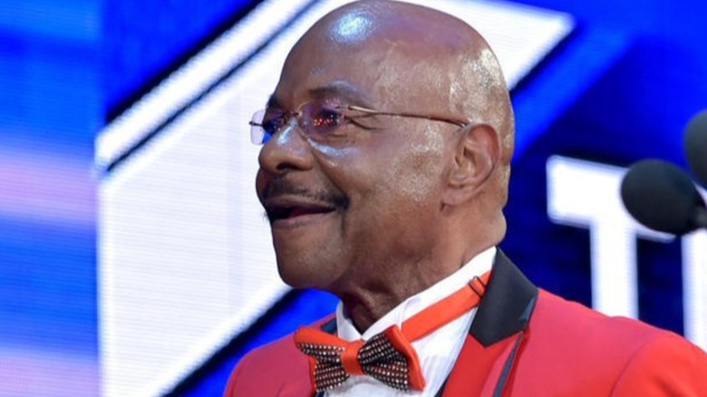 Teddy Long smiling 