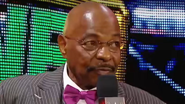 Teddy Long talking into microphone