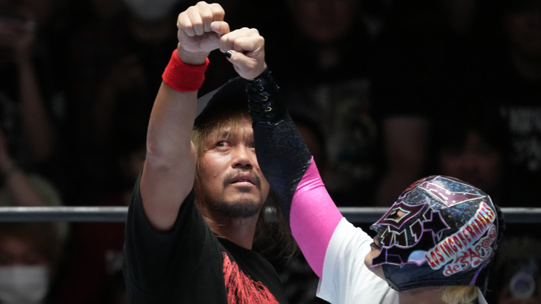 Tetsuya Naito and BUSHI bump fists