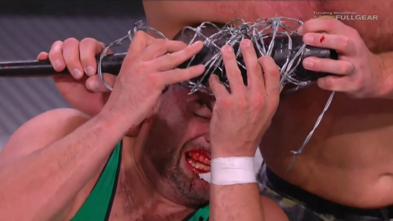 Jon Moxley drives barbed wire into Eddie Kingston's head
