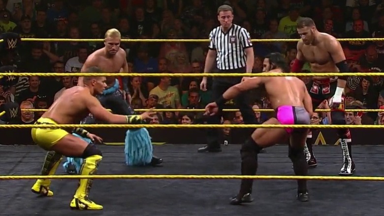 The four competitors at the start of the match