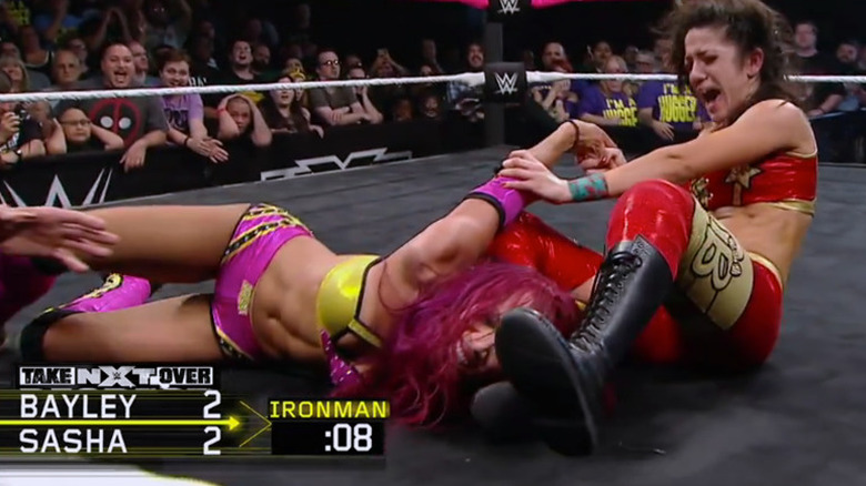 Bayley putting Banks in another submission hold