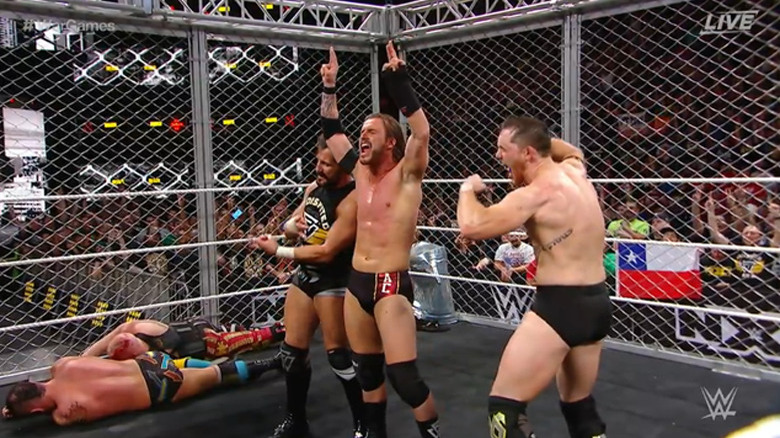 The Undisputed Era celebrating their victory
