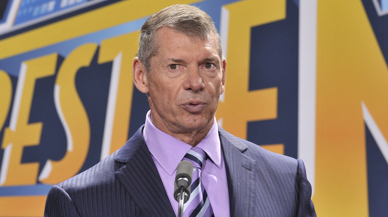 Vince McMahon speaking at a press conference