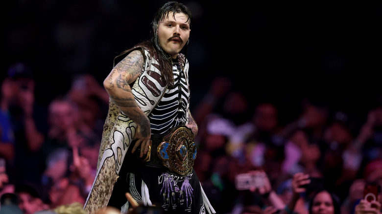 Dominik Mysterio poses with the Intercontinental Title