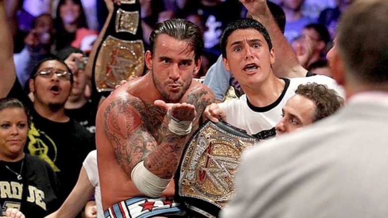 CM Punk blows a kiss at Vince McMahon