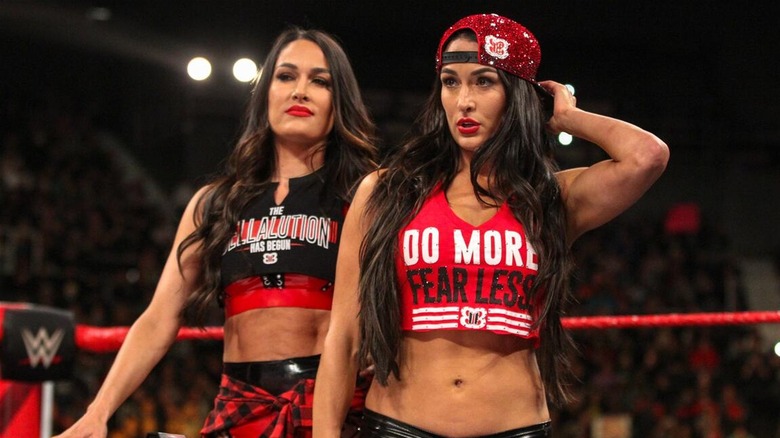 The Bella Twins in ring ahead of Nikki Bella's clash with Ronda Rousey.
