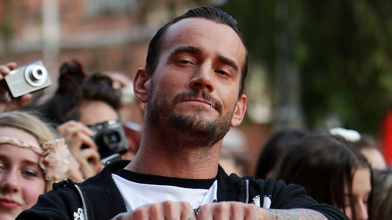 2011 CM Punk shows off his tattoos