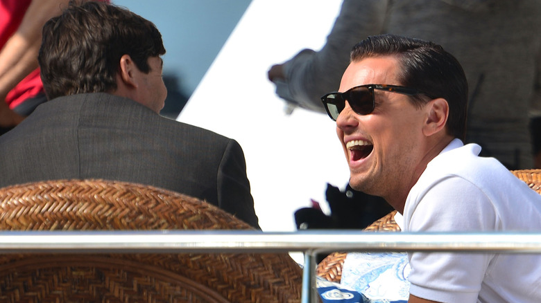 Leonardo DiCaprio laughs at Kyle Chandler on the set of The Wolf Of Wall Street