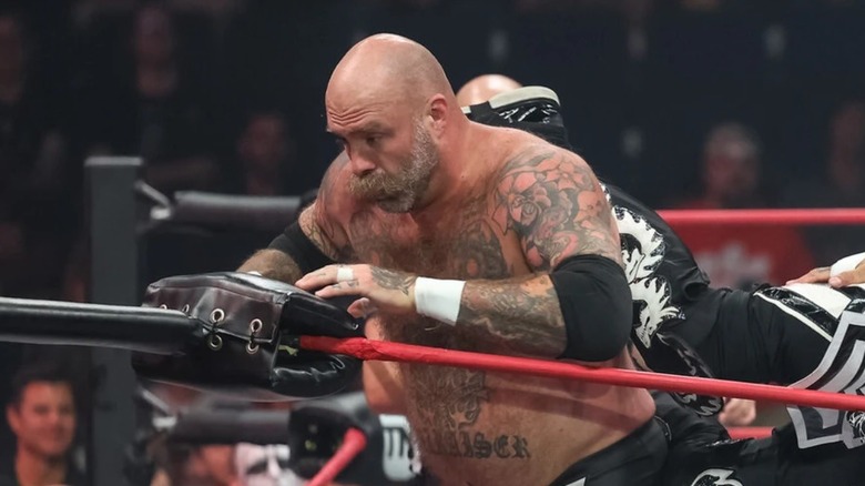 The Butcher faces the turnbuckle