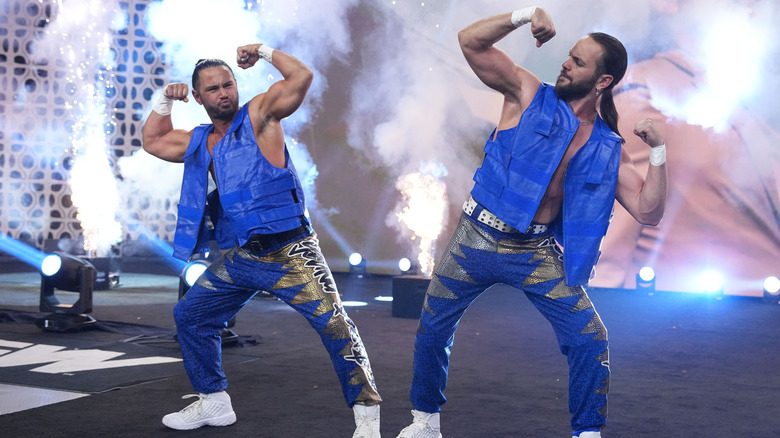 The Young Bucks hit their pose on the stage before a match on an episode of AEW programming.