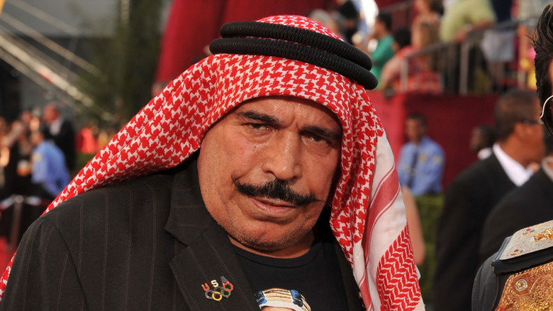Iron Sheik poses