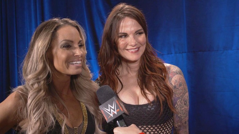 Trish Stratus and Lita talk backstage.