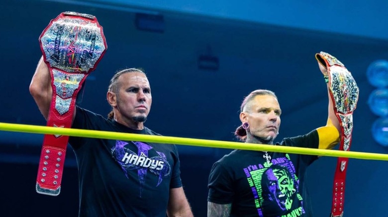 The Hardys (Matt and Jeff) hold their TNA World Tag Team Championships high above their heads