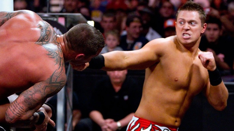 The Miz preparing to punch Randy Orton