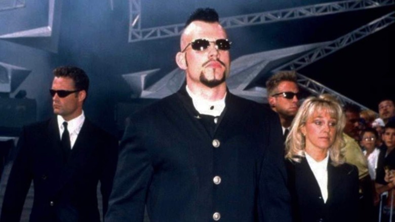 WCW talent Berlyn makes his way down to the ring with his entourage during an episode of WCW programming.