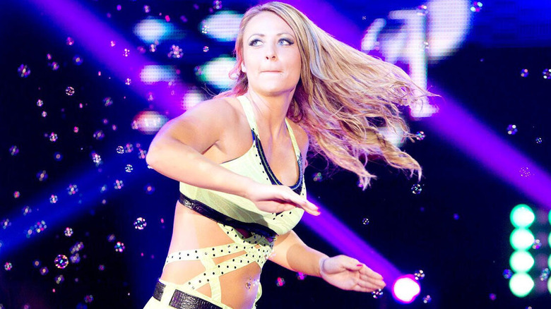 Emma makes her entrance during "WWE NXT," dancing along to her theme music as bubbles float in the air.