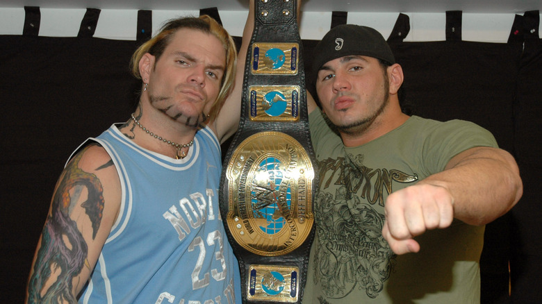 Jeff and Matt Hardy pose together with the Intercontinental Championship