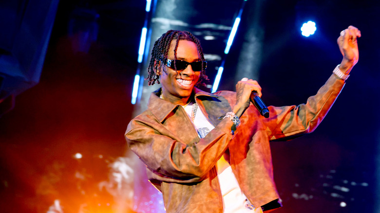 Rapper Soulja Boy dances onstage during a performance