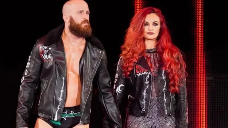 Mike Bennett holds the hand of his wife, Maria Kanellis-Bennett on the stage before the couple heads down to the ring before a match on WWE progrmaming.