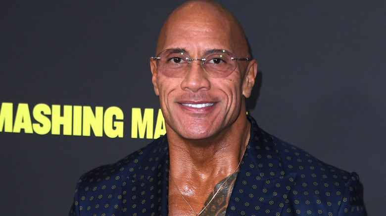 the rock smiling on red carpet