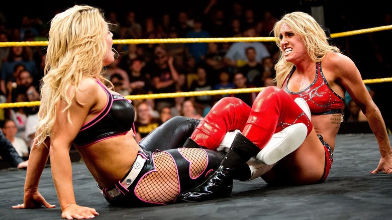 Natalya and Charlotte Flair at WWE NXT Takeover in 2014