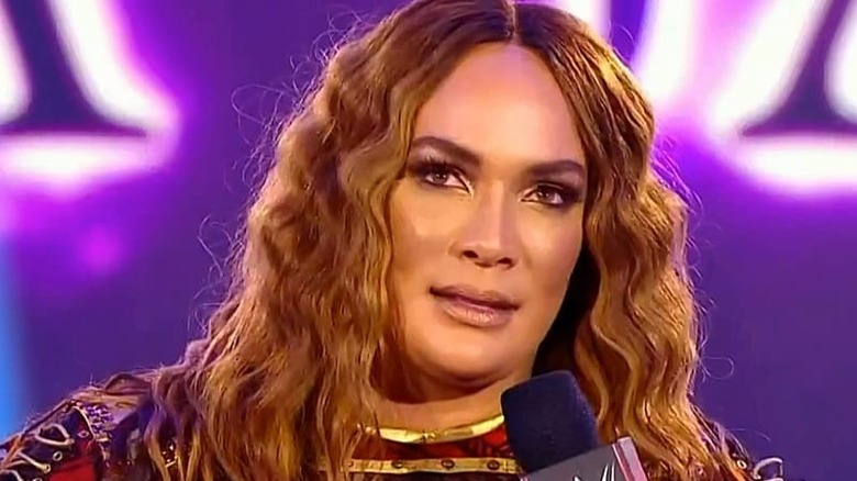 Nia Jax holding a microphone