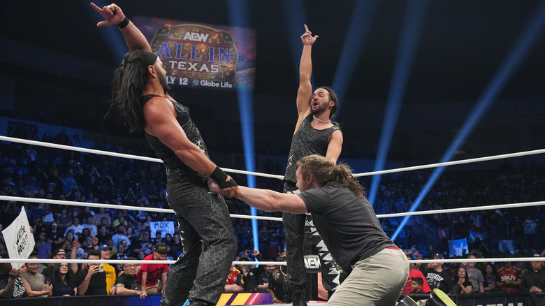 The Young Bucks pose before delivering the EVP Trigger to Kenny Omega on 