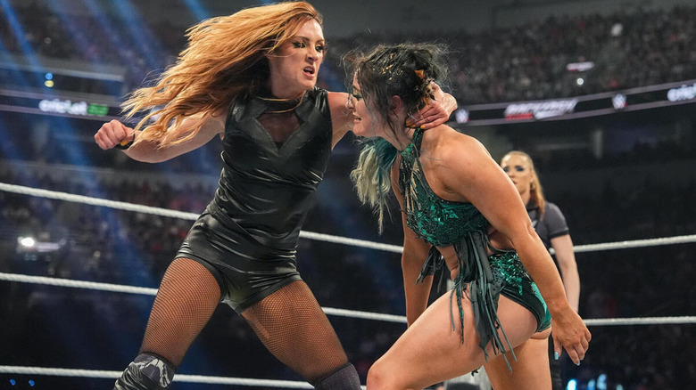 Becky Lynch looks to lay a right hand into Lyra Valkyria.
