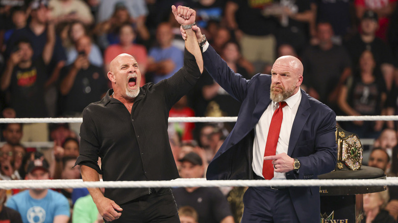 Goldberg with Paul Levesque in the ring