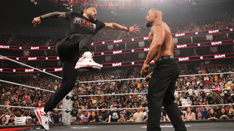 Roman Reigns looks to level Bron Breakker with a Superman Punch