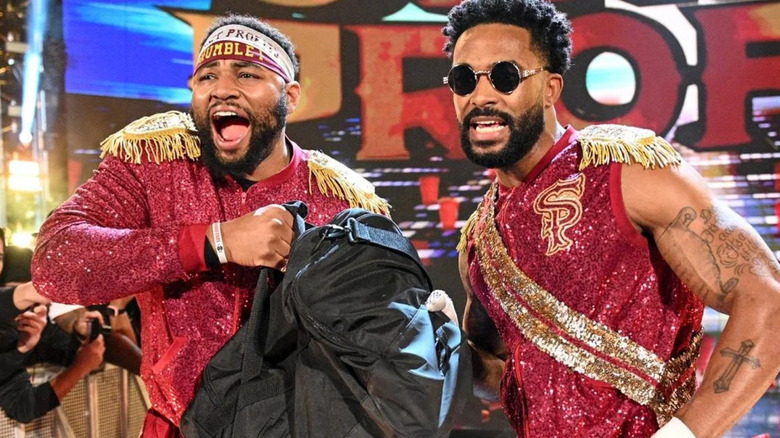 Angelo Dawkins and Montez Ford wearing red ring gear