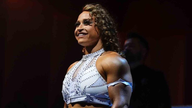 Jordynne Grace stands smiling in the ring before her NXT Women's Championship match against Roxanne Perez at Battleground 2024.